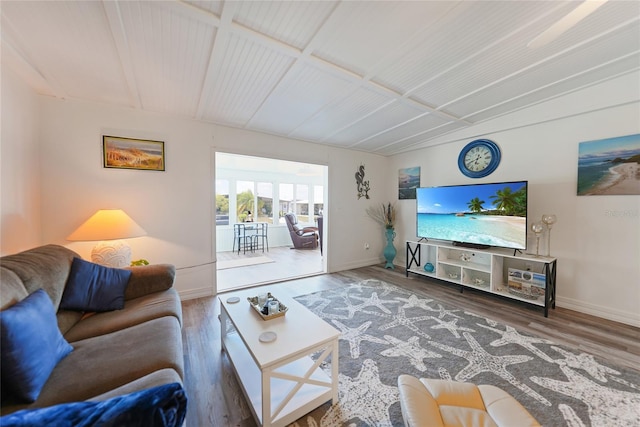 living room featuring baseboards and wood finished floors