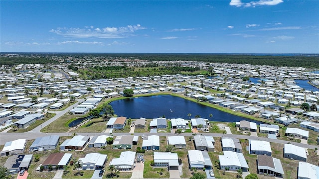 drone / aerial view featuring a water view and a residential view