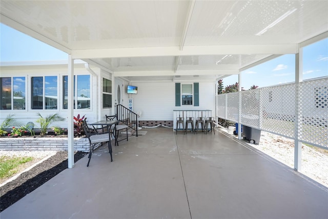 sunroom with beamed ceiling