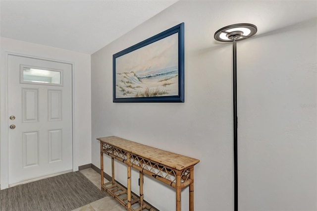 entrance foyer with light tile patterned floors