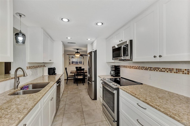 kitchen with white cabinets, stainless steel appliances, and sink