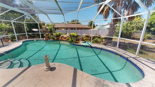 view of swimming pool with a lanai