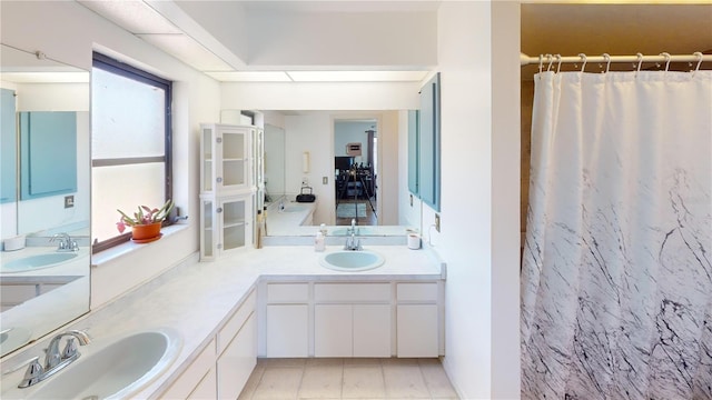 bathroom with vanity and curtained shower