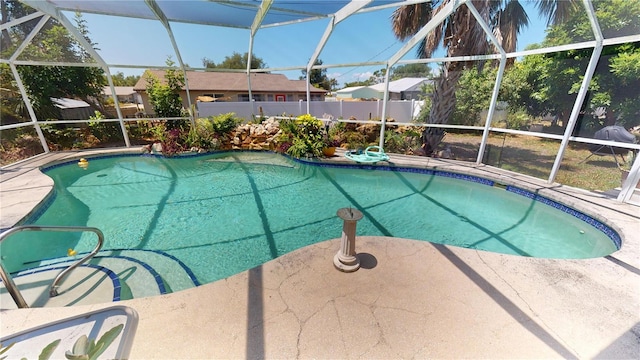 view of pool with a lanai