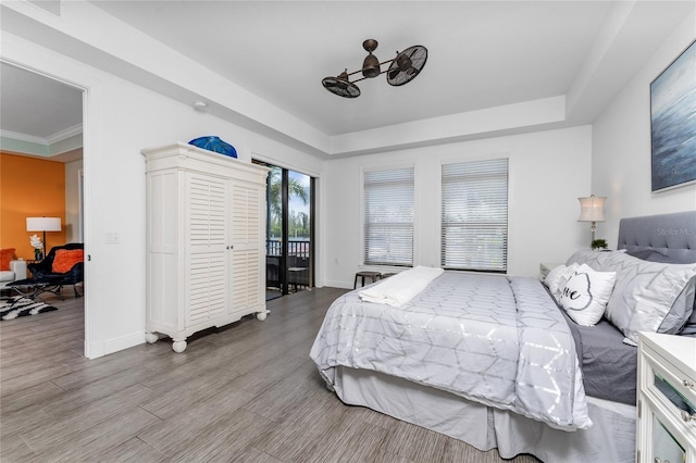 bedroom with crown molding and light hardwood / wood-style flooring