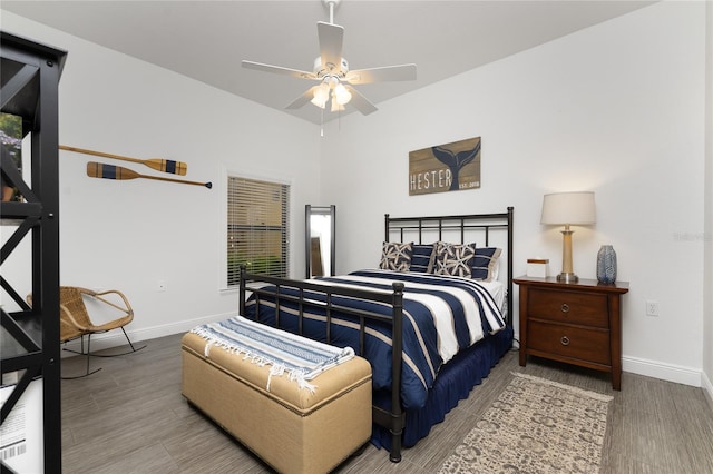 bedroom with wood-type flooring and ceiling fan