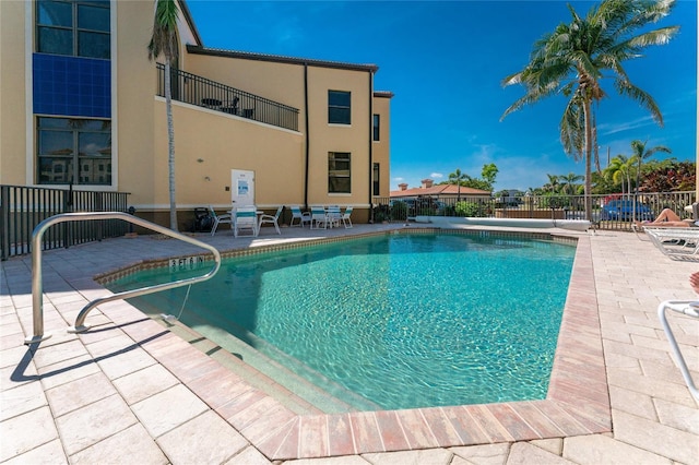 view of pool featuring a patio