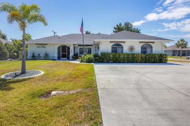 single story home featuring a front lawn