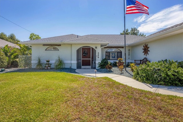 ranch-style home featuring a front lawn