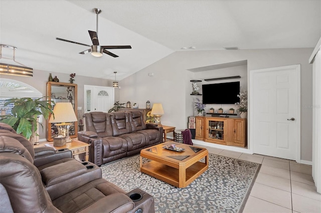 tiled living room featuring ceiling fan with notable chandelier and lofted ceiling