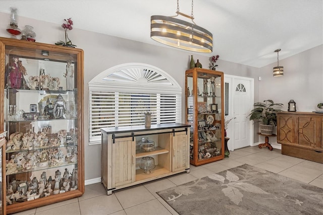 tiled dining area with an inviting chandelier