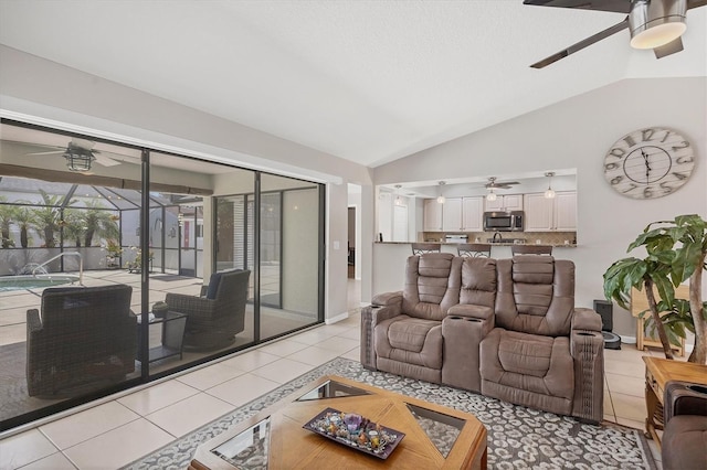 living room featuring light tile patterned floors and vaulted ceiling