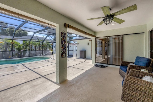 view of patio / terrace featuring ceiling fan, a lanai, and a fenced in pool