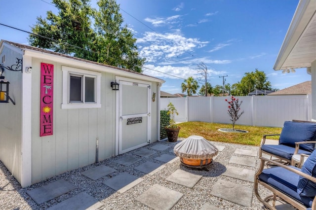 view of patio / terrace with a shed