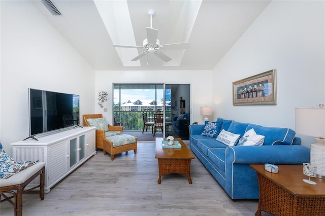 living room featuring ceiling fan and light hardwood / wood-style floors