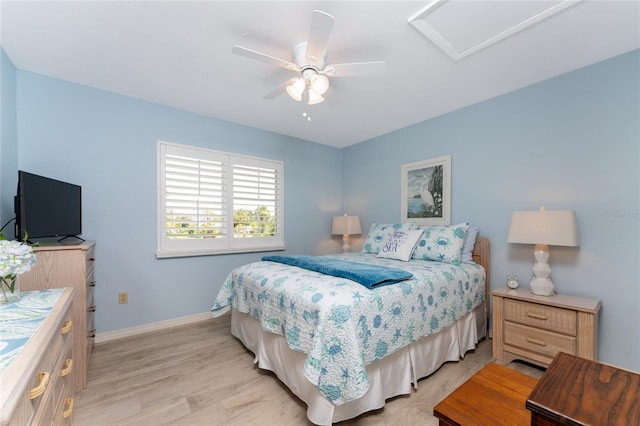 bedroom with ceiling fan and light wood-type flooring