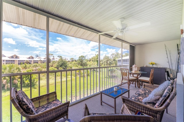 sunroom / solarium with ceiling fan