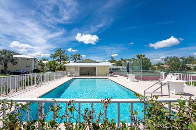 view of swimming pool with a patio area