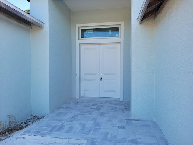 2170 Doolittle Ln, Port Charlotte, FL 33953 - doorway to property with stucco siding