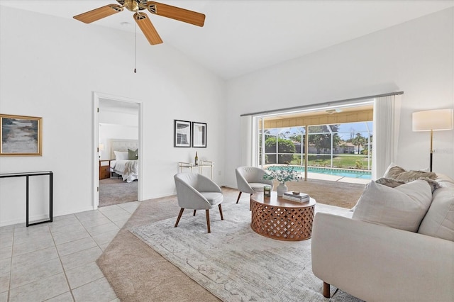 living room with light tile patterned floors, high vaulted ceiling, and ceiling fan