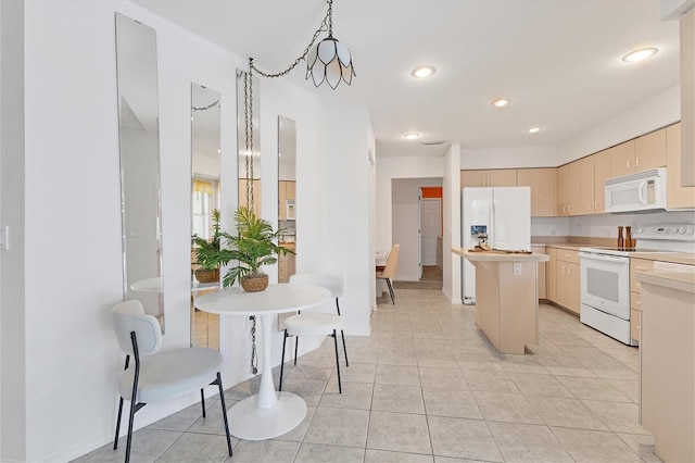 kitchen with a center island, light brown cabinets, white appliances, an inviting chandelier, and light tile patterned floors