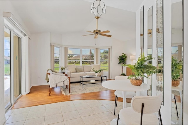 sunroom / solarium with vaulted ceiling and ceiling fan