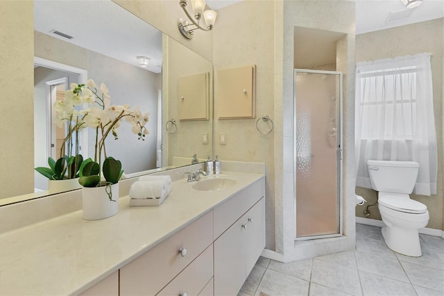 bathroom with toilet, vanity, tile patterned floors, and an enclosed shower