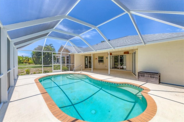 view of pool with a lanai and a patio area