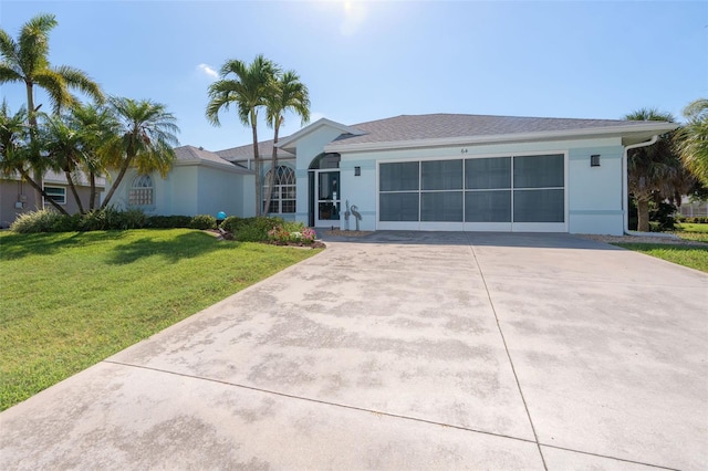 single story home with a front lawn