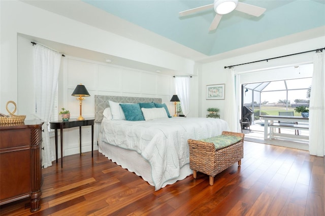 bedroom featuring access to exterior, ceiling fan, and dark wood-type flooring