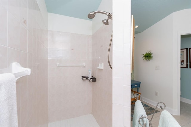 bathroom featuring tiled shower and tile patterned floors