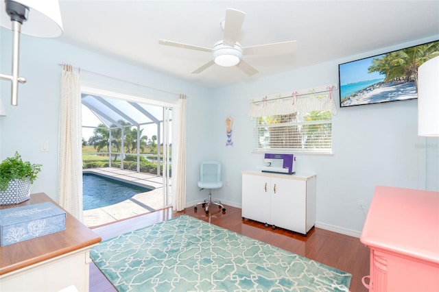 bedroom with light wood-type flooring, access to outside, and ceiling fan