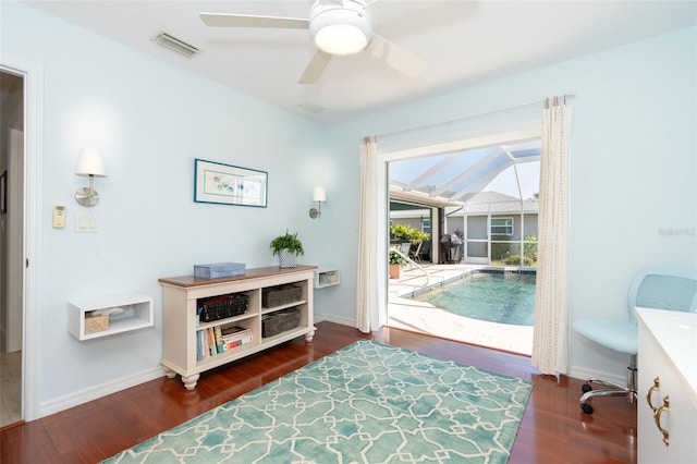 interior space with ceiling fan and dark wood-type flooring