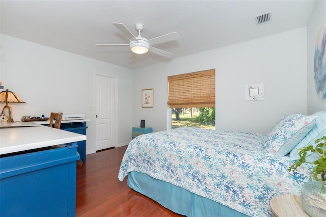 bedroom with ceiling fan and dark hardwood / wood-style floors