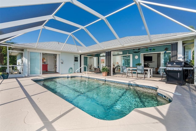 view of pool with a grill, a lanai, and a patio