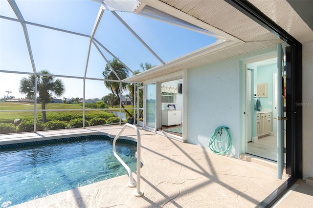 view of pool with a lanai and a patio area