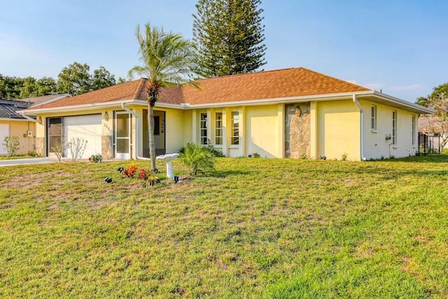 ranch-style house with a front lawn and a garage