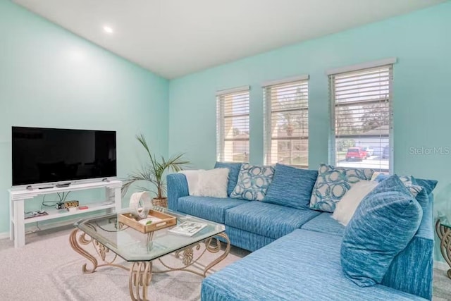 living room featuring plenty of natural light and carpet floors