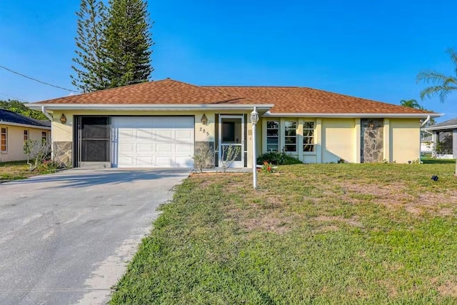 single story home featuring a garage and a front yard