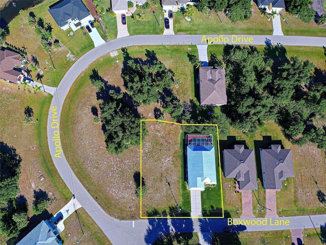 birds eye view of property with a residential view