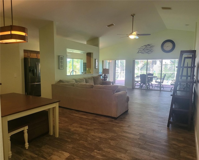 living room featuring plenty of natural light, ceiling fan, dark hardwood / wood-style flooring, and high vaulted ceiling