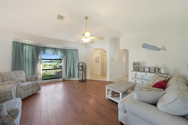 living room with lofted ceiling, hardwood / wood-style flooring, and ceiling fan