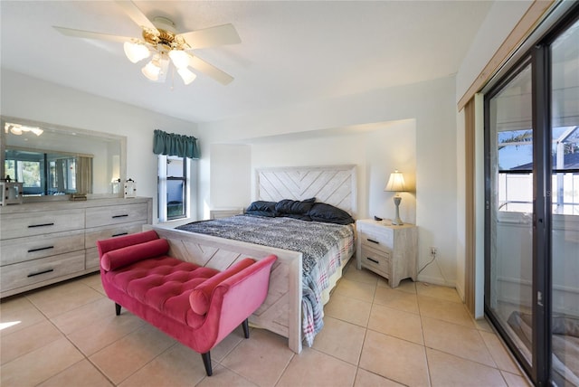 tiled bedroom featuring ceiling fan