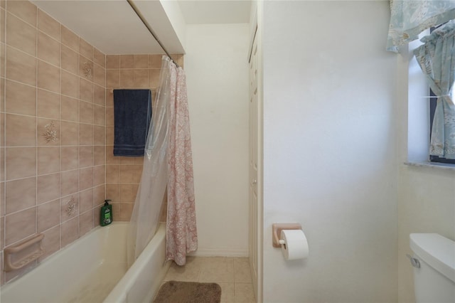 bathroom featuring shower / tub combo, toilet, and tile patterned flooring