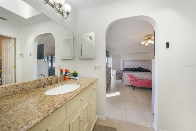 bathroom featuring tile patterned flooring and vanity