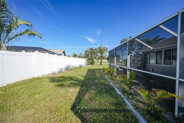 view of yard with a lanai