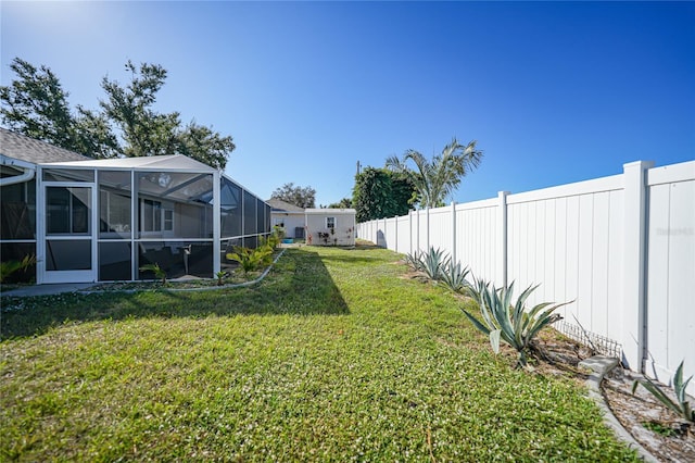 view of yard with a lanai