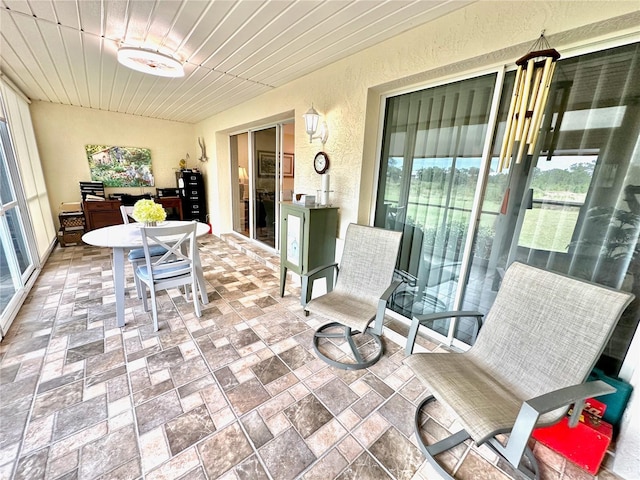 sunroom / solarium with wood ceiling