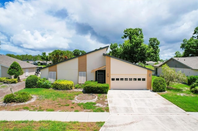 single story home with a garage and a front yard