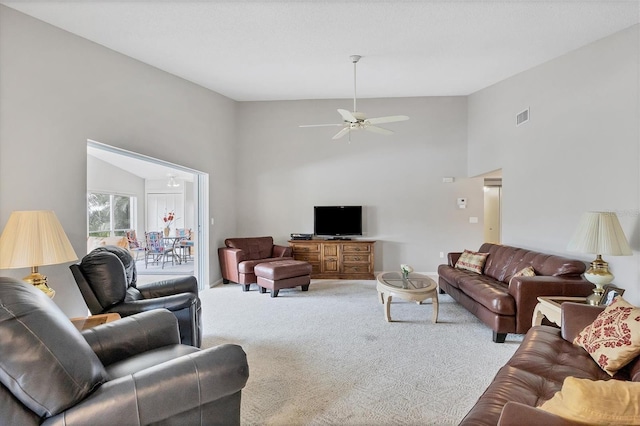 carpeted living room featuring ceiling fan